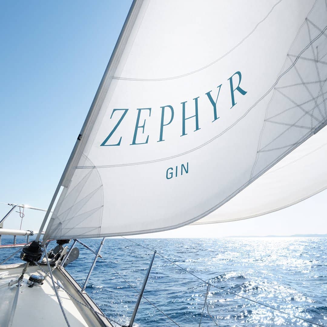 Zephyr Gin Branding on White Ocean Sail with Blue Wordmark Logo